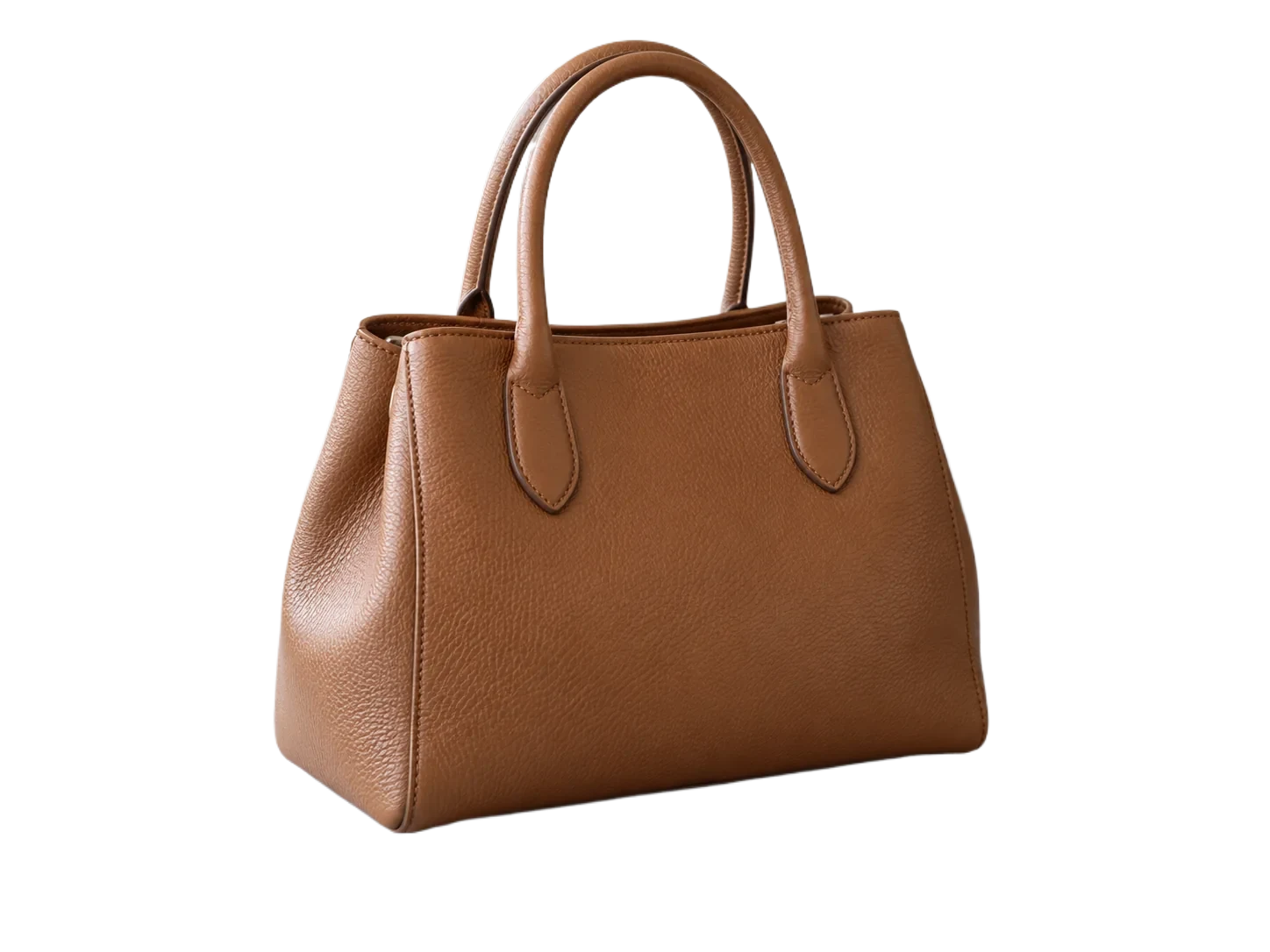 Background removed: Brown leather handbag on a stone table